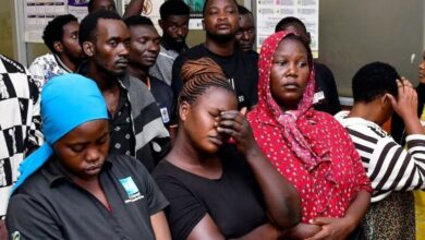 Suspects arrested for public nuisance, inciting violence and obstructing police officers during the recently concluded general elections stand at the City Hall Magistrate’s Court, where they were charged, in Kampala, Uganda, January 19, 2026. REUTERS/Abubaker