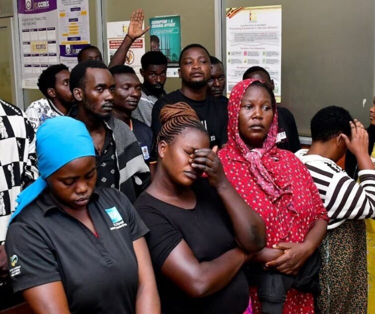 Suspects arrested for public nuisance, inciting violence and obstructing police officers during the recently concluded general elections stand at the City Hall Magistrate’s Court, where they were charged, in Kampala, Uganda, January 19, 2026. REUTERS/Abubaker